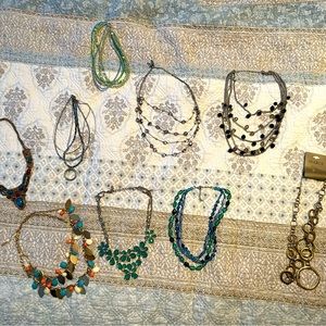 9 necklaces.  Some brand new, variety of colors.